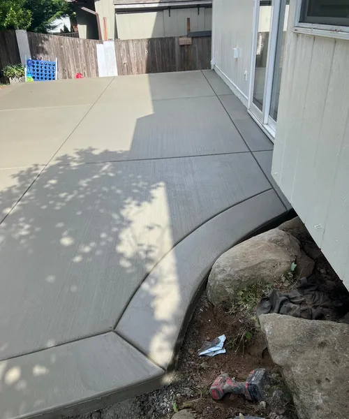 Broom finish patio and decorative borders in Covington 